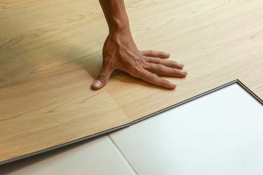 hand on wooden plank